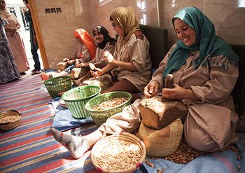 Women crushing argan nuts