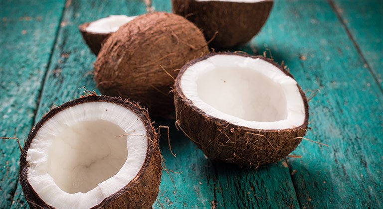 Coconut oil is a superfood for curly hair. Discover why and learn how to use  it!